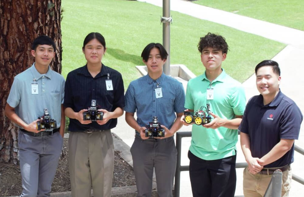 L3Harris Mentees Posing With Their Robotics During Their Workplace Mentorship.