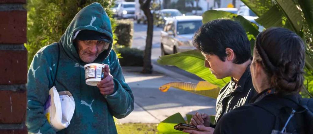 City Net Data Specialist Stephen Su and Julie Bechtol, manager in the OC Office of Care Coordination, right, talk to a man for the Everyone Counts, Point In Time survey in Tustin, CA on Tuesday, January 27, 2026. The county-wide survey provides data on the homeless population. (Photo by Paul Bersebach, Orange County Register/SCNG)